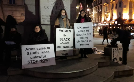 Women holding banners at WiB Vigil