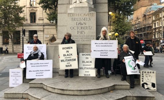 Women in Black vigil 26 0924, Invest in Climate Justice, women with banners